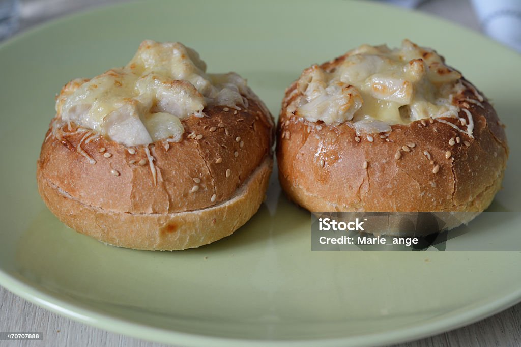 pair of buns filled with chicken julienne and baked pair of buns filled with chicken julienne and baked, on a plate 2015 Stock Photo