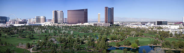 Las Vegas Nevada Skyline in Daylight Las Vegas, United States - March 7, 2015: Landscape view of new high rises and golf course in Las Vegas, Nevada. The view includes a distant view of the strip and buildings including the Whynn, Encore, Trump Tower and a variety of other prominent structures. wynn las vegas stock pictures, royalty-free photos & images