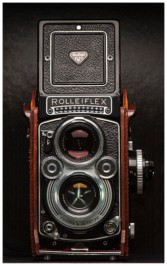 Vancouver, Canada - March 15, 2015: Twin lens reflex (TLR) style vintage film camera on display. Camera pictured is a 1966 Rolleiflex 3.5F model TLR.