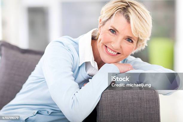 Pretty Senior Woman Relaxing On A Couch Stock Photo - Download Image Now - Active Seniors, Adult, Adults Only
