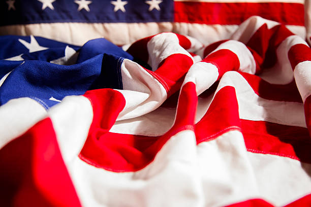 istock American flag with folds. Side view. Dramatic lighting. Patriotism. 470724474