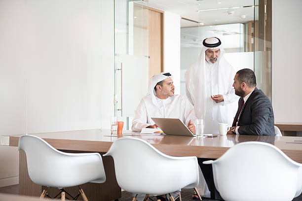 istock Arab businessmen discussing at conference table 470724782