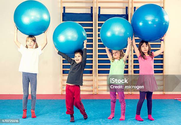 Children At Physical Education Class Stock Photo - Download Image Now - Child, Fitness Ball, Boys