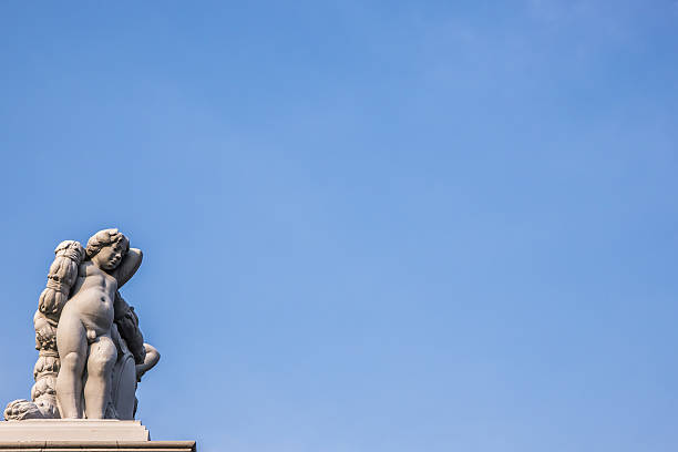 istock Angel statue art on fence 470725638