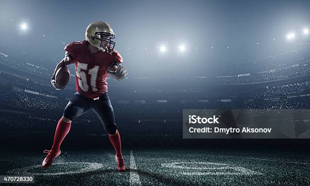 American Football In Action Stock Photo - Download Image Now - American Football Player, American Football - Sport, American Football - Ball