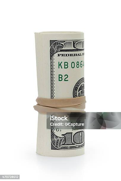 Rolled Hundred Dollar Banknotes Tied With Rubberband Stock Photo - Download Image Now