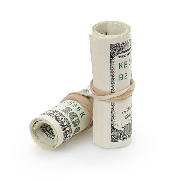 istock rolled hundred dollar banknotes tied with rubberband 470728528