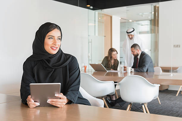 istock Businesswoman holding digital tablet while looking away 470731122