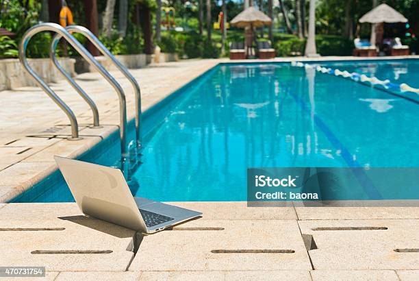 Laptop Beside A Pool Stock Photo - Download Image Now - 2015, Breaking, Business