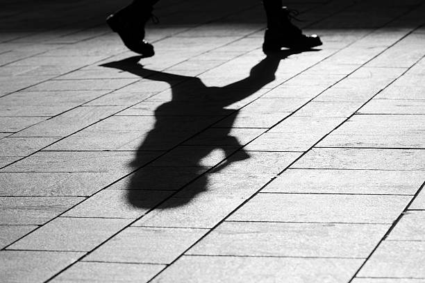istock sun casting shadow over a businessman on his way 470732564
