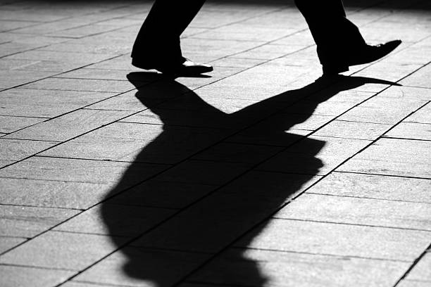 istock sun casting shadow over a businessman on his way 470732566