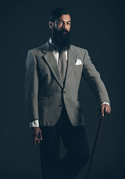 istock Man with Long Beard Wearing Formal Suit with Cane 470736514