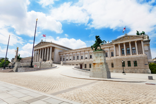 Austrian Parliament Building and statue on one of downtown squares