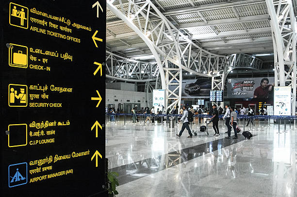 New Delhi airport New Delhi, India - April 3, 2015: Passenger in New Delhi airport. Indira Gandhi International Airport serves as the primary civilian aviation hub for the National Capital Region of Delhi, India. In 2010, Indira Gandhi International Airport was conferred the fourth best airport award in the world in the 15–25 million category, and Best Improved Airport in the Asia-Pacific Region india airport stock pictures, royalty-free photos & images