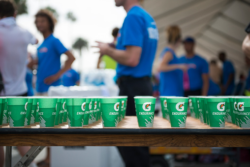 Santa Monica, California, USA - March 15, 2015: Outside a massage tent beyond the finish line of the Los Angeles Marathon, a table is stocked with paper Gatorade cups.