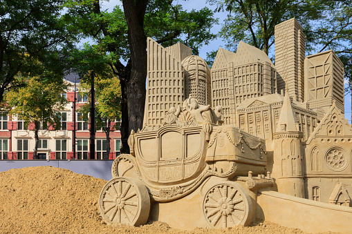 The Hague, Netherlands - September 16, 2014: sandcastles on Buitenhof in The Hague during Prinsjesdag depicting the characteristic Knights' Hall, the Mauritshuis, the Golden Coach and the cities modern office buildings.