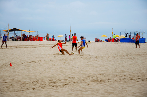 Rio De Janeiro, Brazil - March 7, 2015: People playing soccer on the beach at Copacabana beach