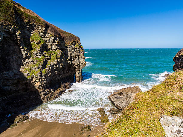 Overlooking the sandy beach at Bossiney Cove Tintagel Cornwall England UK Europe