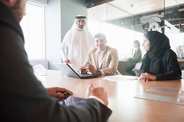 istock Businessman discussing with team at conference table 470745380