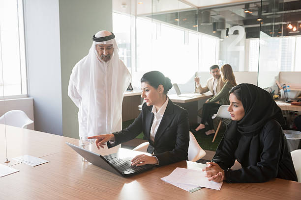 istock Middle Eastern businesswoman discussing over laptop with team 470745384