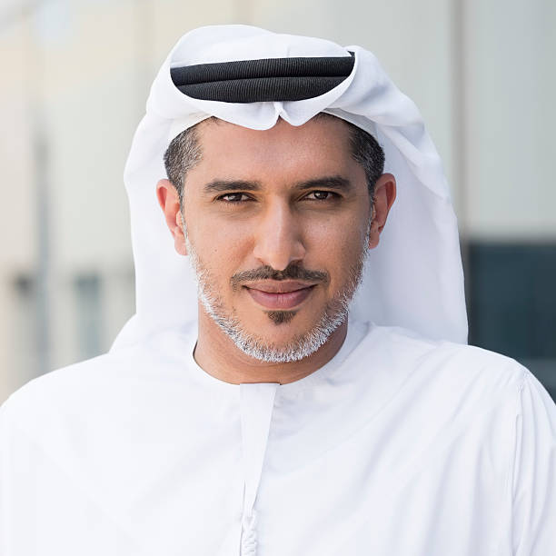 istock Arab man in traditional thobe  outside office building 470745436