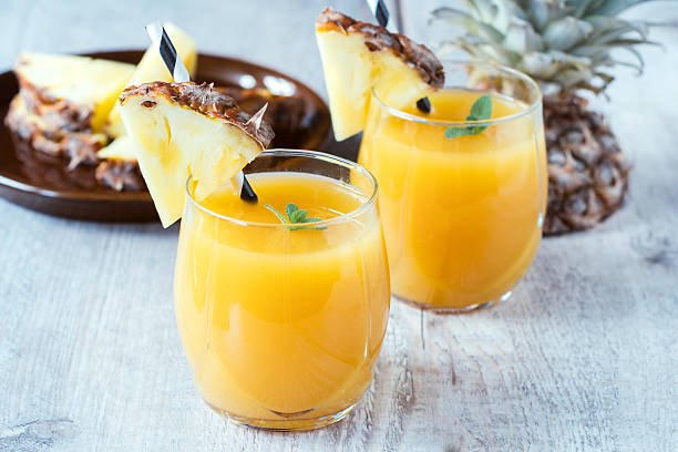 Freshly squeezed tropical fruit juice with pineapple  stock photo