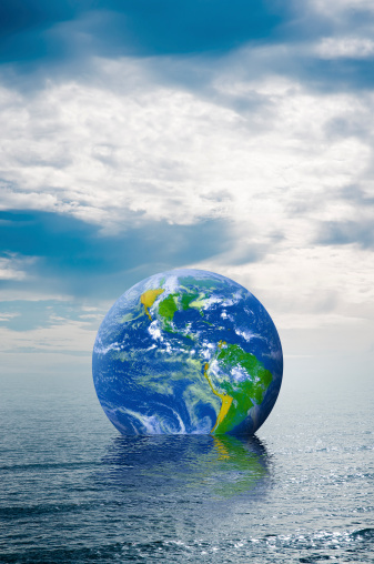 Picture of globe floating in the ocean.