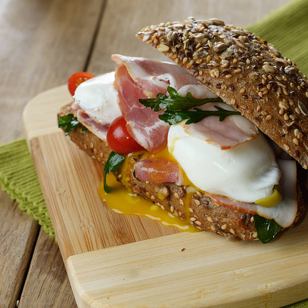 Bacon and poached eggs sandwich