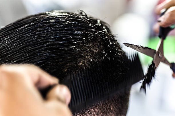 istock Barber cutting hair 470750841