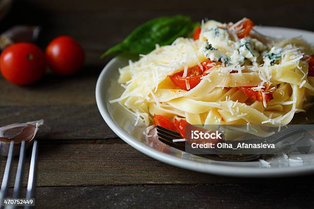 Appetizing Pasta With Cheese And Tomatoes Stock Photo - Download Image Now - Appetizer, Backgrounds, Basil