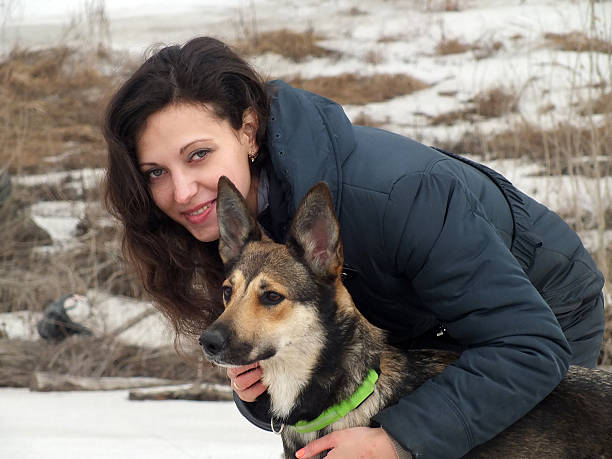 istock beautiful woman with dog 470755042