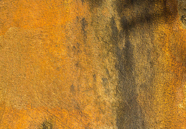 istock Grunge stained of yellow concrete wall background 470755876