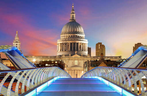 Millennium Bridge leads to Saint Paul's Cathedral in central London at night