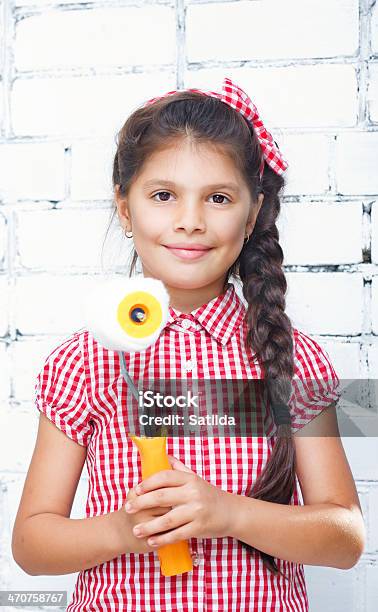 Girl Holding Paint Roller Stock Photo - Download Image Now - 8-9 Years, Art And Craft, Blue-collar Worker