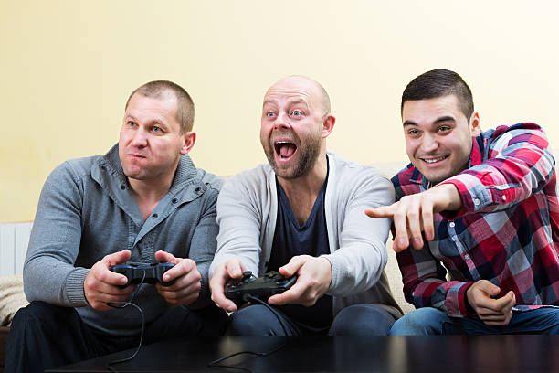istock Adult guys sitting with joysticks 470759054