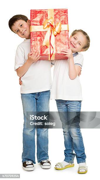 Boy And Girl With Gift Box Stock Photo - Download Image Now - 2015, Birthday, Birthday Present
