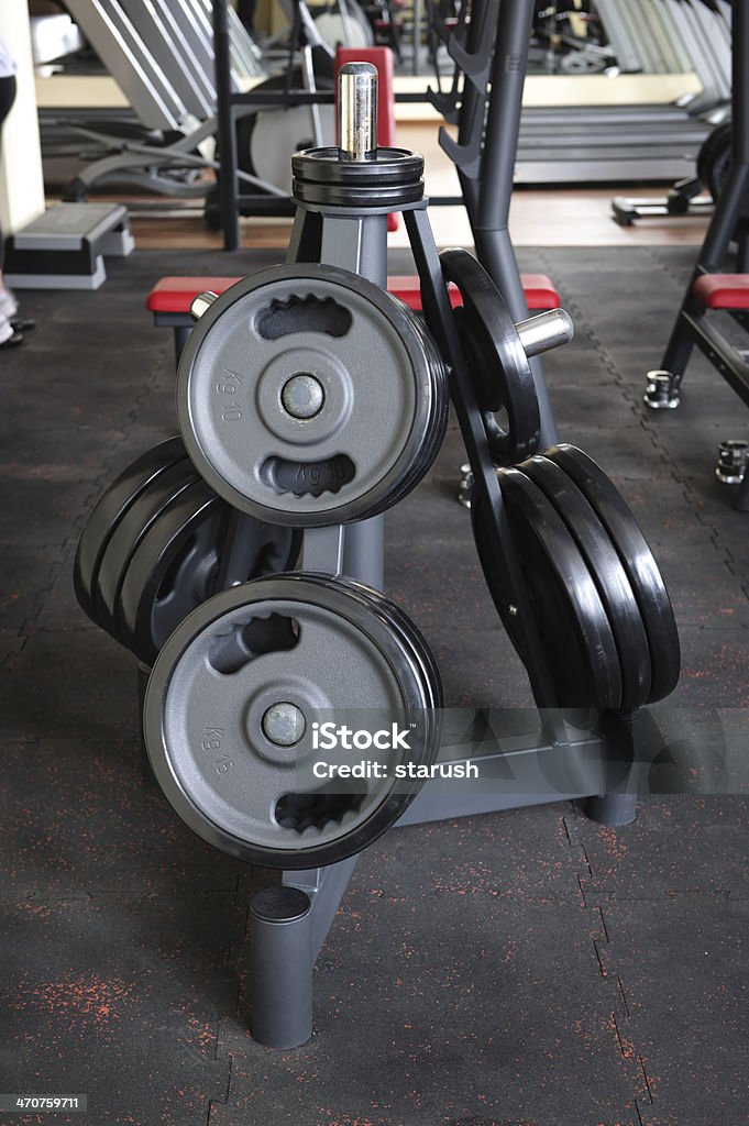 Barbell plates rack Barbell plates holder rack in the gym Anaerobic Exercise Stock Photo