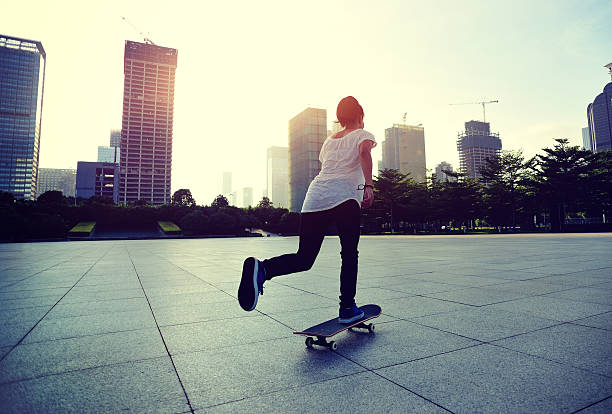 istock skateboarding woman at city 470759826