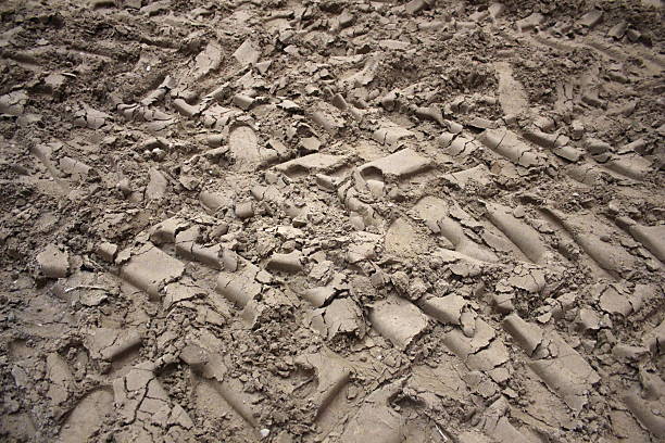 istock Gravel road with vehicle tire tracks 470760174