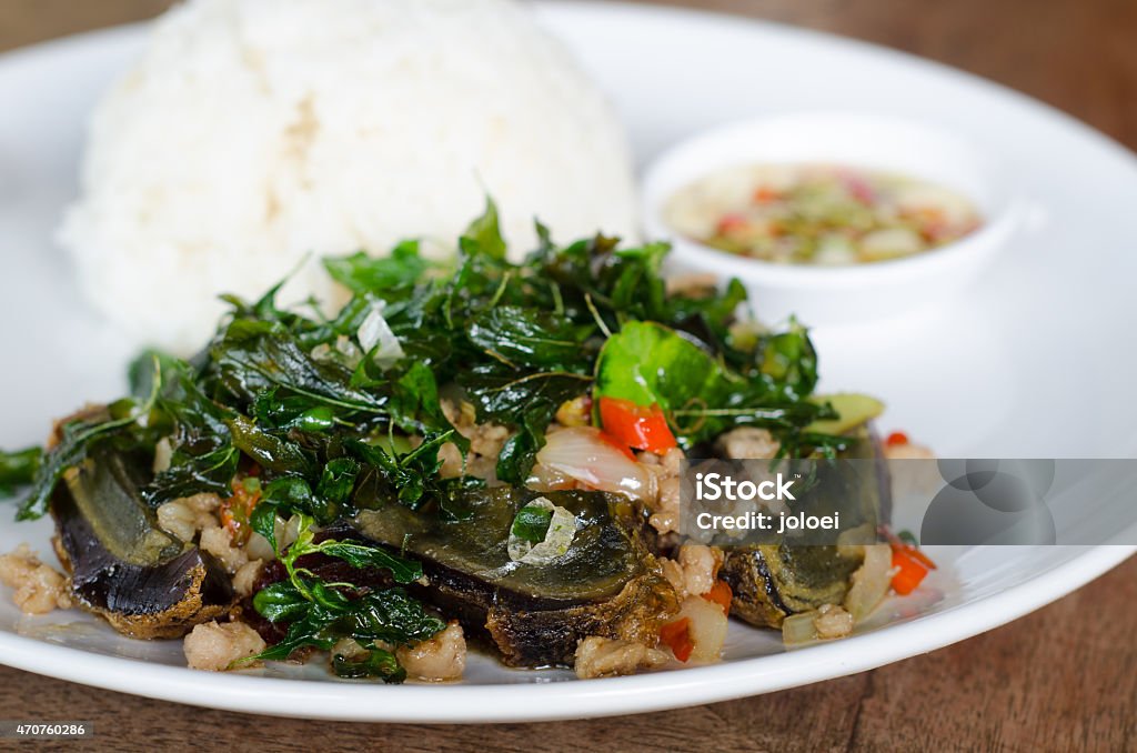 Fried century egg with crispy holy basil Egg - Food Stock Photo