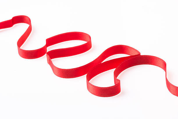 istock Red silk twisted ribbon in the form 470760378