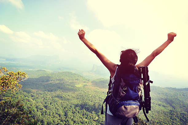 istock woman photographer on mountain peak 470760680