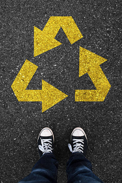 istock Recycling on asphalt with waiting people 470760904
