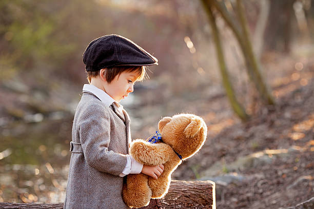 istock Adorable little boy with his teddy bear friend 470760914