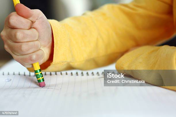 Childs Hand Erasing With Pencil On Notebook Paper Stock Photo - Download Image Now - Mistake, Child, Spelling - Education