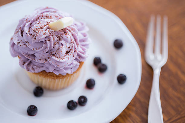 Christmas cupcakes - homemade cupcakes with cacao, blueberry jam and ricotta cream decorated. Sugar free, gluten free pastry. Healthy pastry dessert.