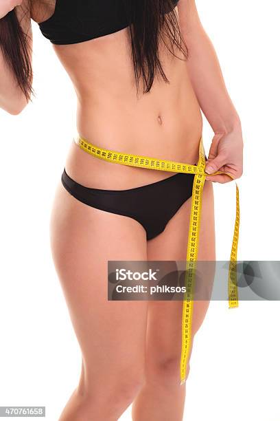 Young Woman Measuring Her Waist Stock Image Stock Photo - Download Image Now - 20-29 Years, 2015, 25-29 Years