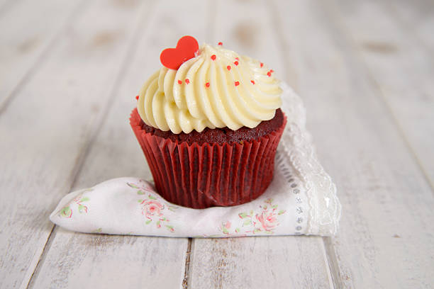red velvet cupcakes with red heart on top