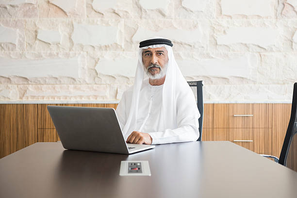 istock Arab businessman with laptop at boardroom table 470765730