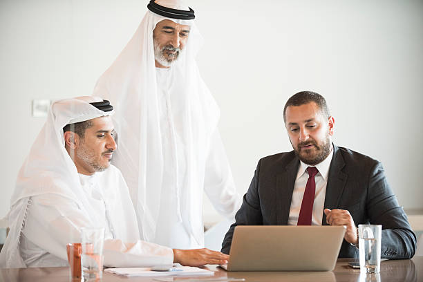 istock Middle East businessmen using laptop at conference table in office 470765738
